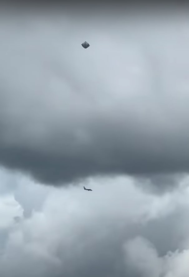 A commercial aircraft is seen flying past on its approach to the airport