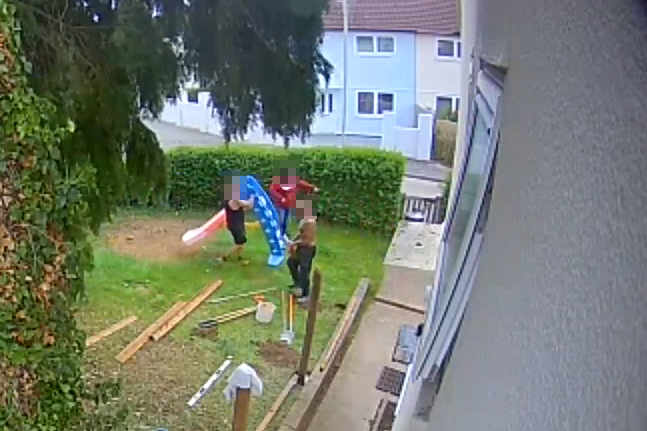 Paul's CCTV showed the moment three people moved his son's slide from the disputed lawn