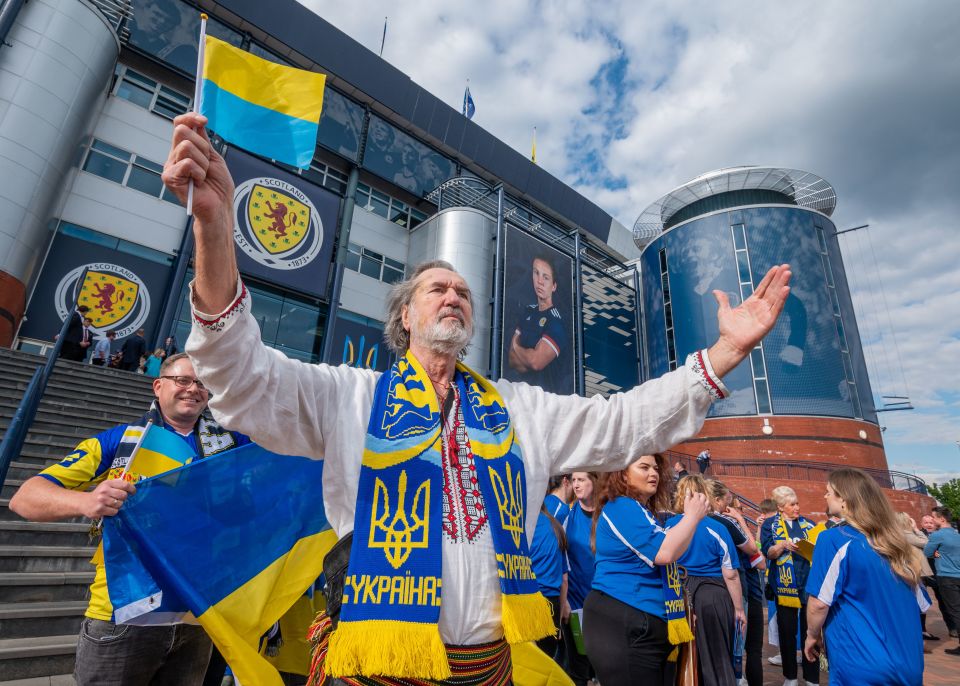 Opera singer Vasyl Savenko was joined by football fans to perform Ukraine's national anthem