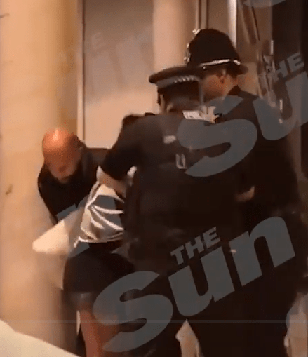 The soap star could be seen struggling as two cops tried to detain her