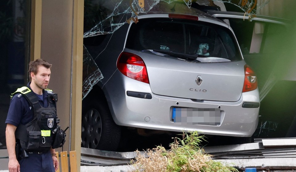 A Renault Clio zigzagged through pedestrians before smashing into a shop