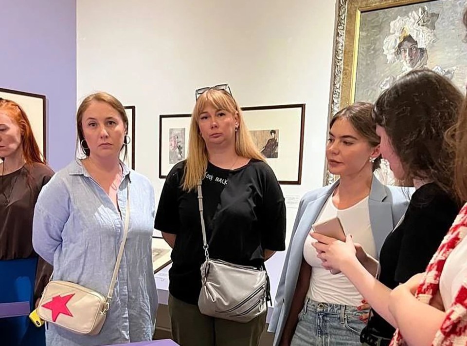 Alina was pictured with grim-faced female companions on a 'private tour' of the city’s Russian Museum