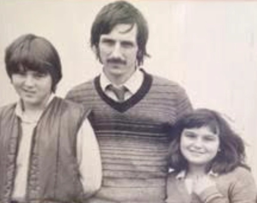 Patrick with his two children around the time of the conflict