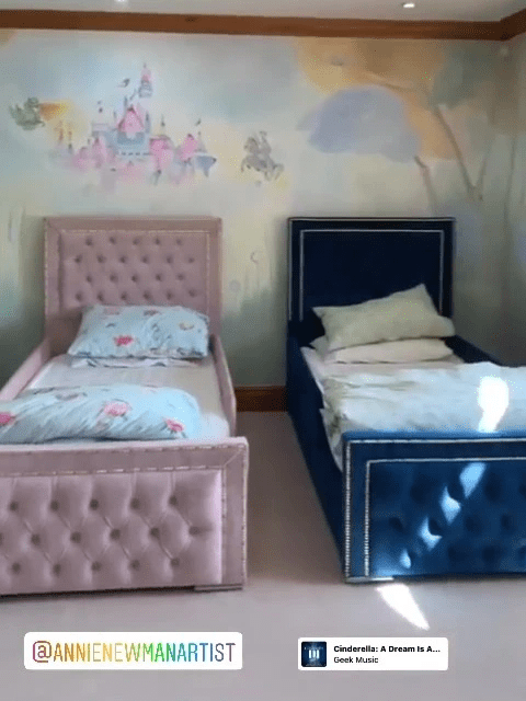 The kids have very plush beds and a castle mural on the wall