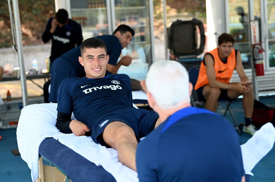 Kai Havertz grinned as he was given a massage to combat the baking sunshine