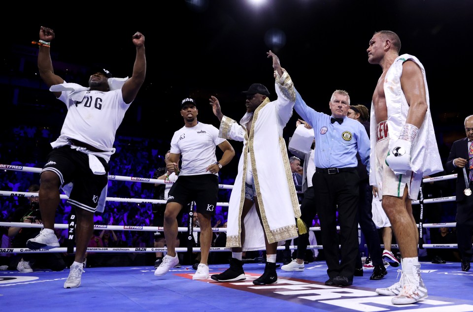 Derek Chisora and his team celebrate after his first win in three years