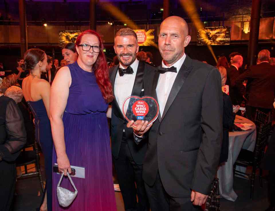 Barney Jones and his partner Teresa with David Beckham