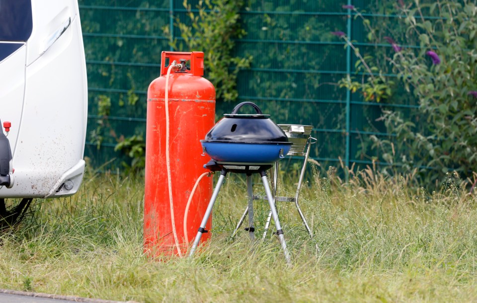 The group parked up their caravans and started a fire yards away from entrance to a 900-pupil school