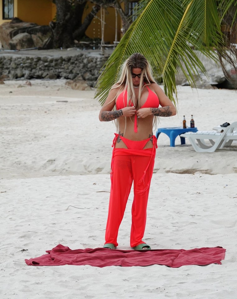 Katie made sure her bikini top was fastened correctly