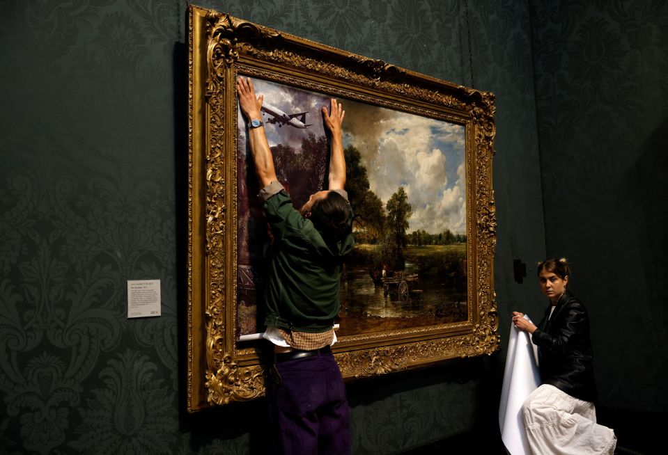 They first covered the painting with their own picture inside the National Gallery, London