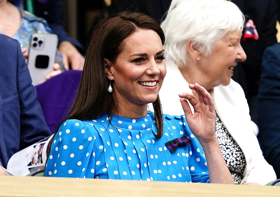 The mum-of-three grinned as she took to her seat in the Royal Box