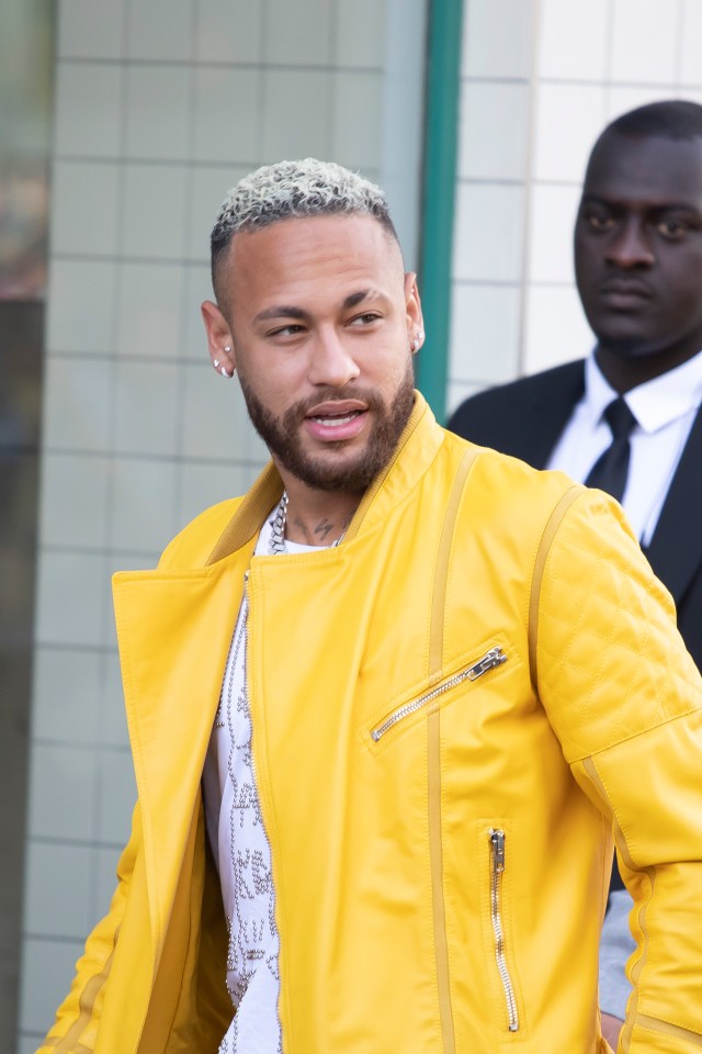 Neymar dons a bright yellow jacket as part of Paris Fashion Week