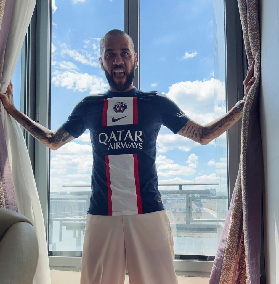 Dani Alves poses in PSG shirt