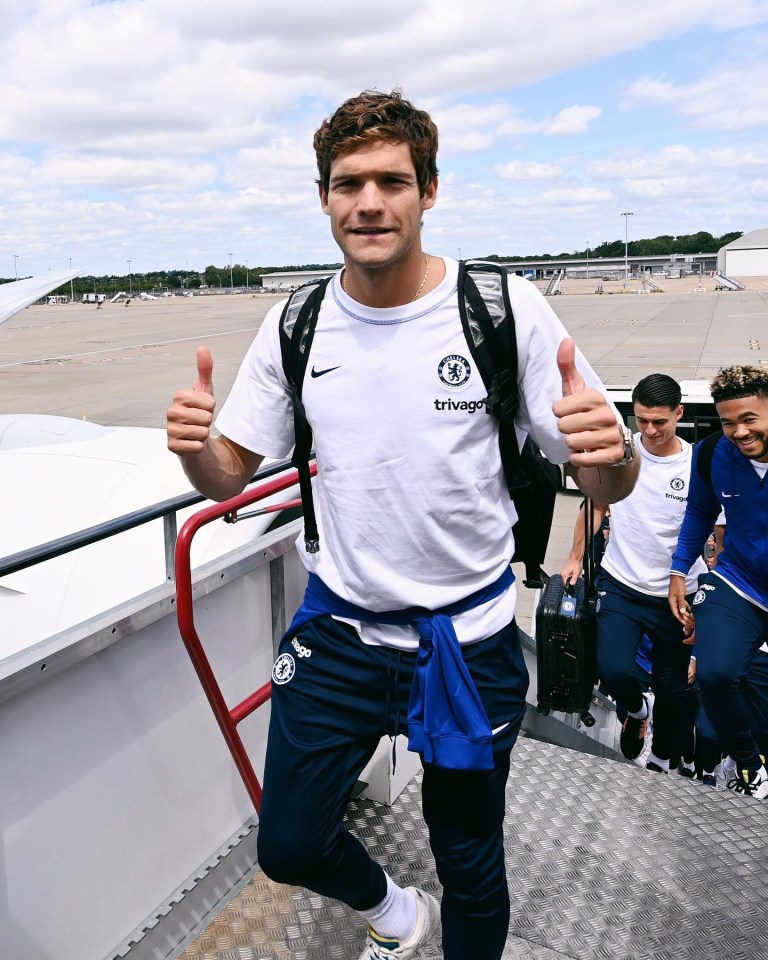 Marcos Alonso gave a thumbs-up as he boarded the plane