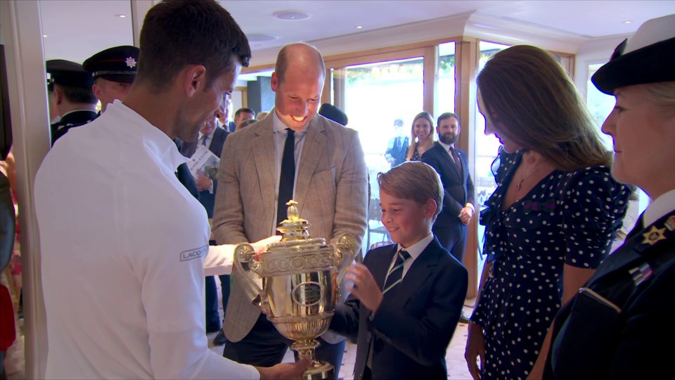 In a sweet moment in the members’ area after the match, Prince George was given the trophy to hold by Djokovic