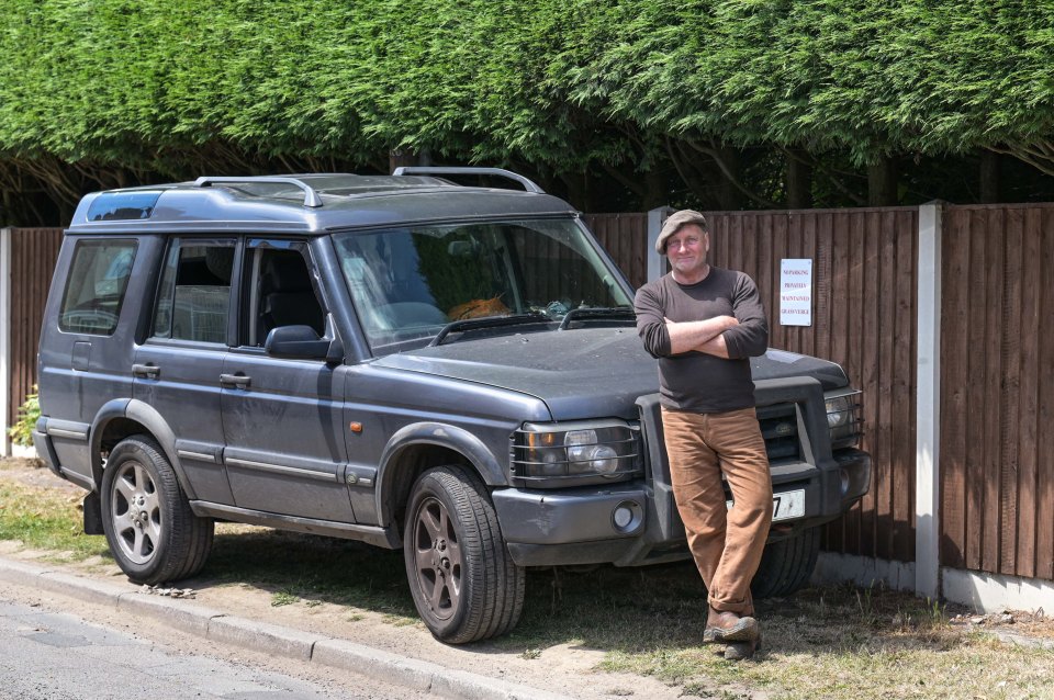 Defiant Steven Riley, 59, claims his neighbour keeps trying to stop him from parking on a council-owned grass verge