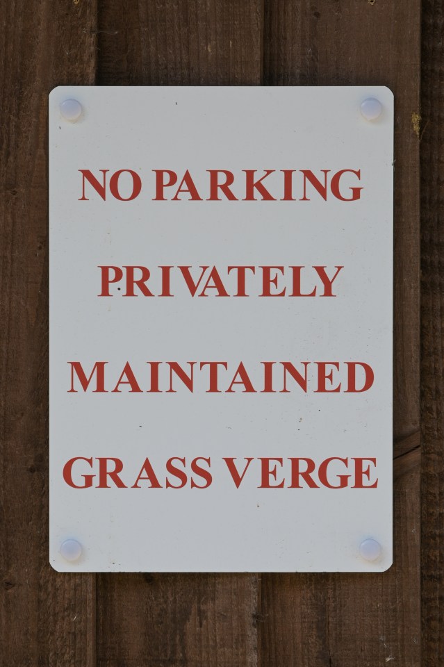 The neighbour has now put up notices on his fence stating: 'No parking, privately maintained grass verge'