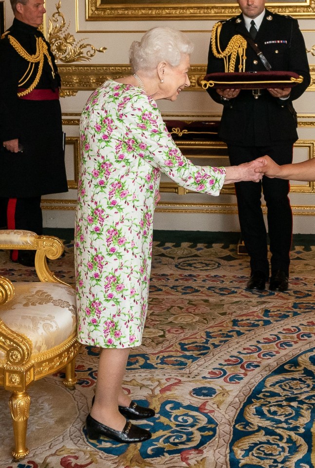 She wore a pretty floral dress for the event