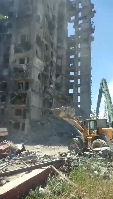 Russian occupiers destroy a damaged building