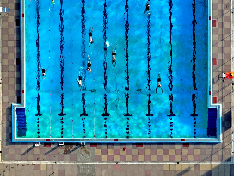 Swimmers enjoy a dip in the Peterborough Lido swimming pool