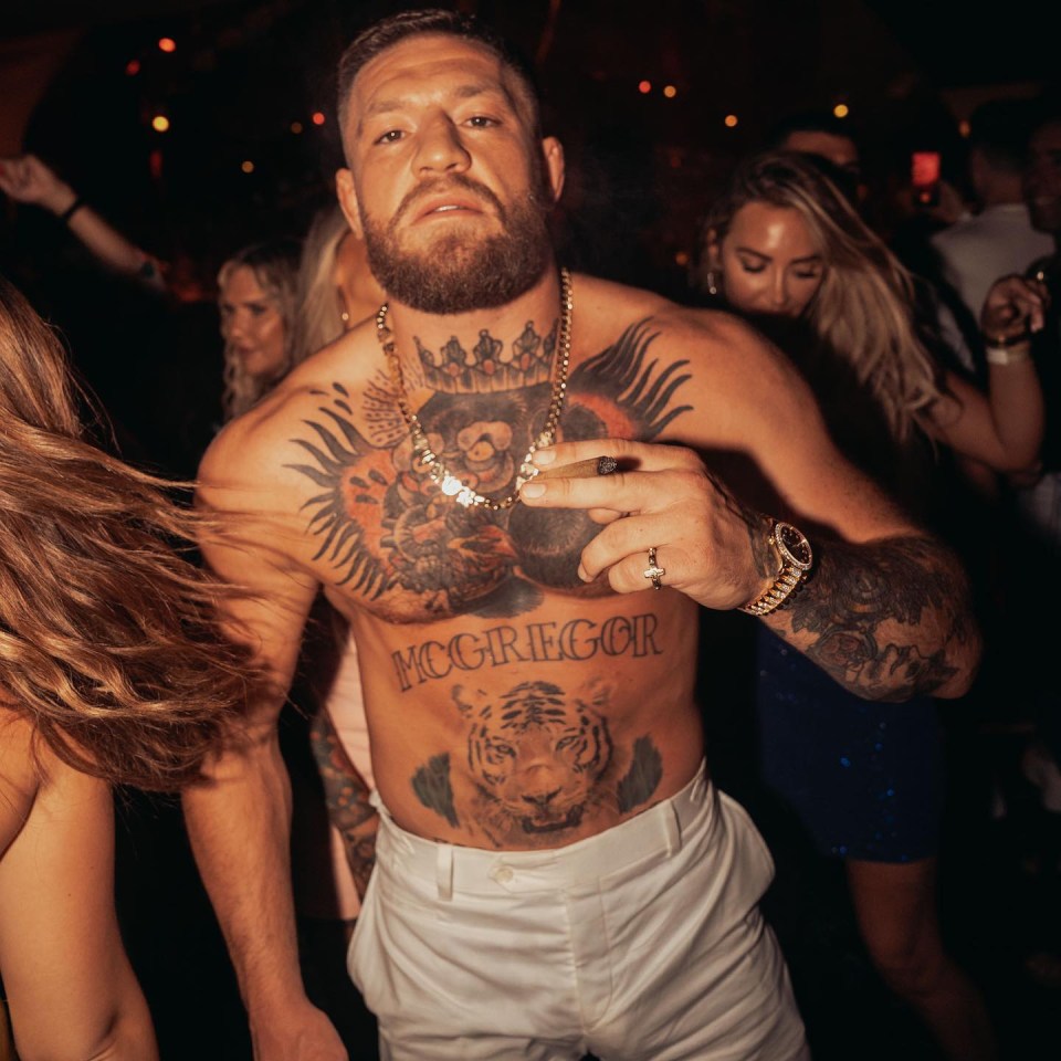 Conor McGregor was agitated when a  fan threw his hat at him during his birthday party