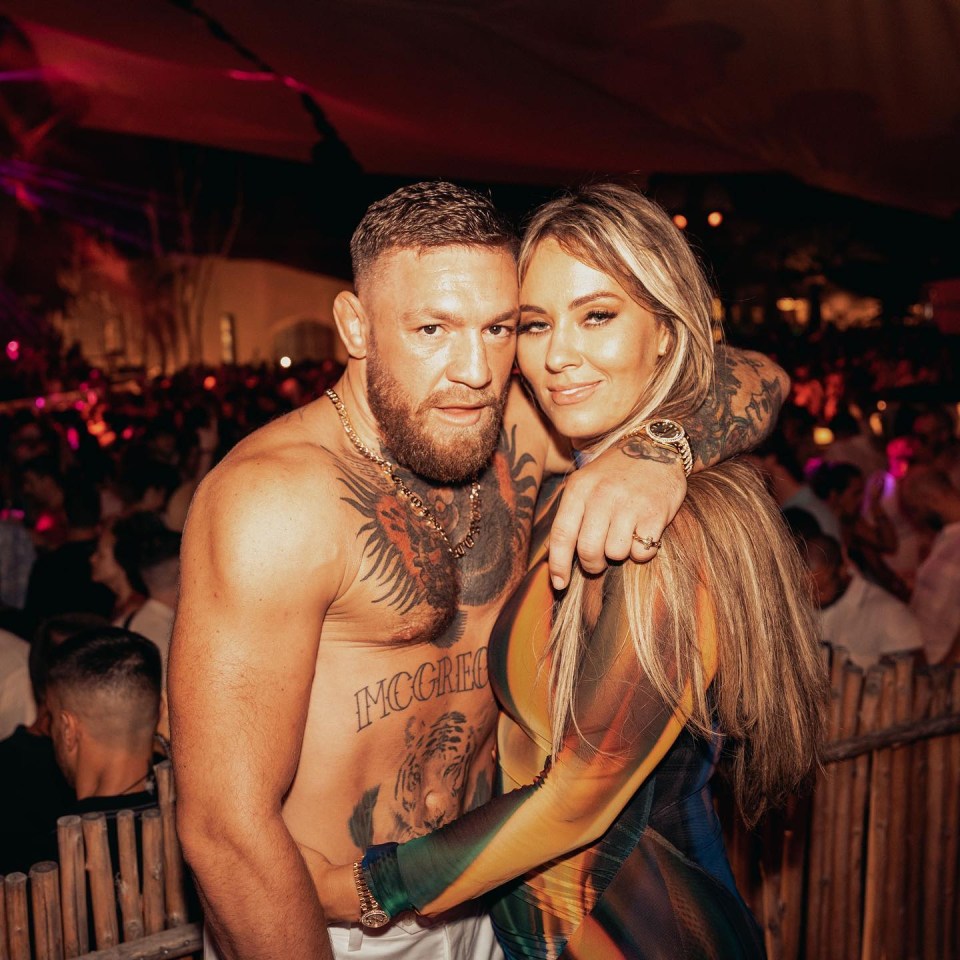 Conor McGregor with his arm around fiancee Dee Devlin