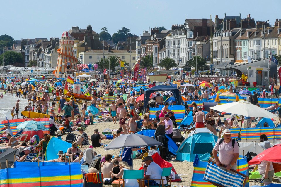 Families and sunbathers have flocked to the the seaside resort of Weymouth