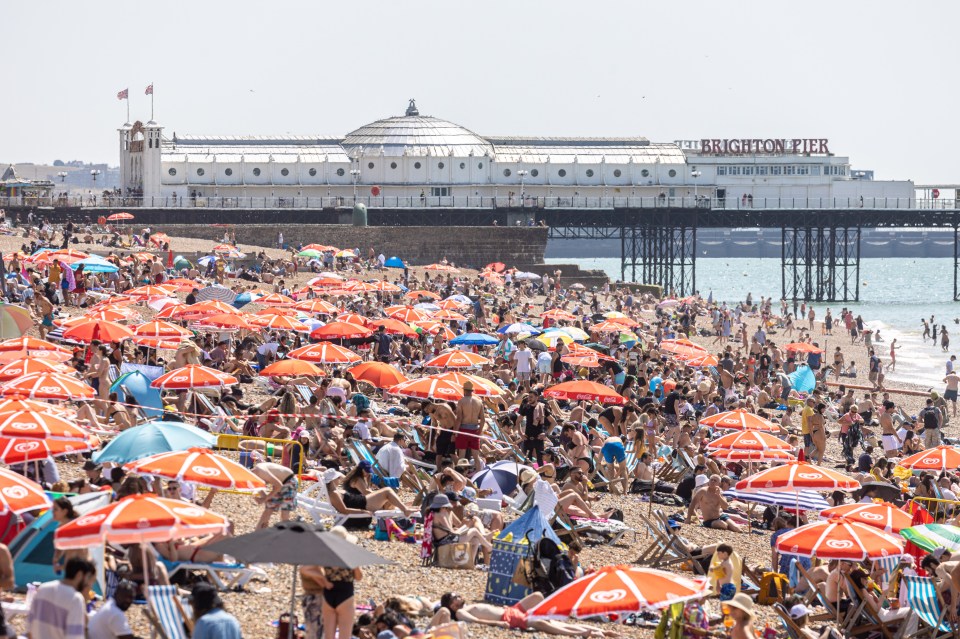 A packed Brighton Beach, Sussex at 11:15am