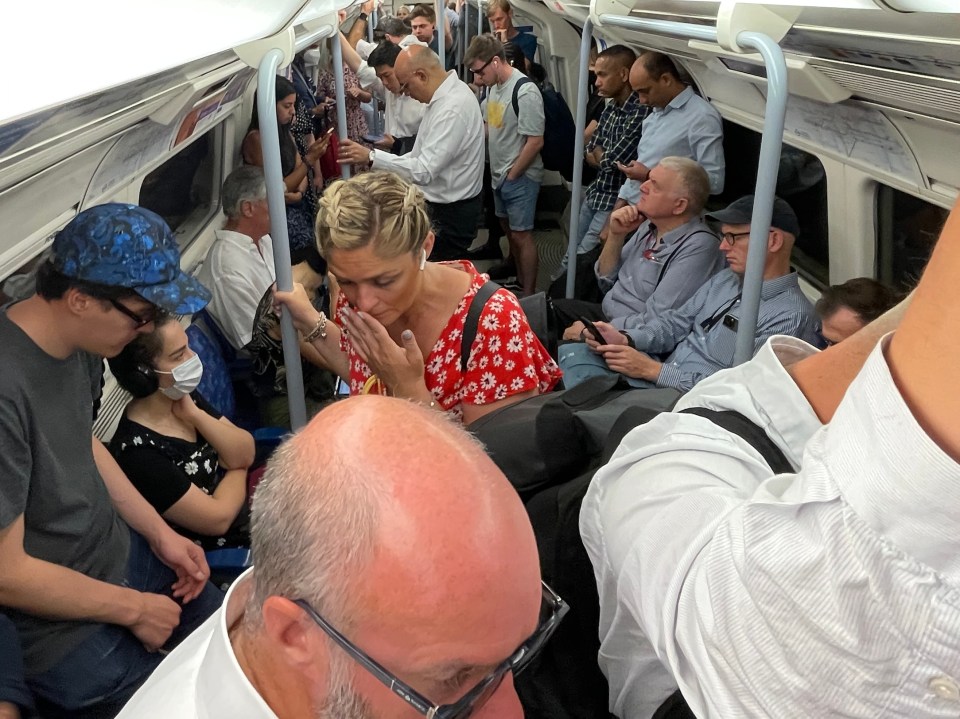 Brits piled onto the sweltering tube in London this morning