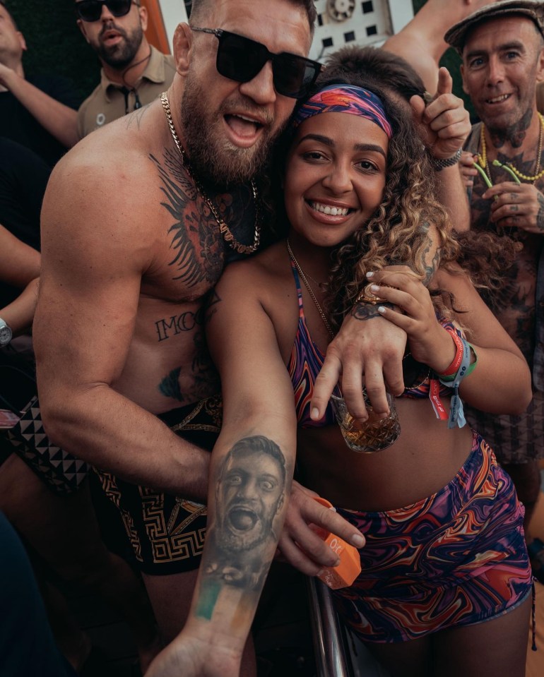 Conor McGregor poses with fan with his face tattooed on forearm