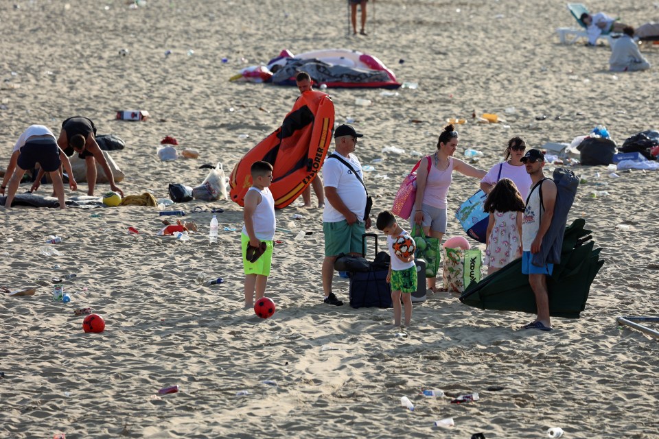 Families set up on the beach in Bournemouth this morning as they brace for another sunny day