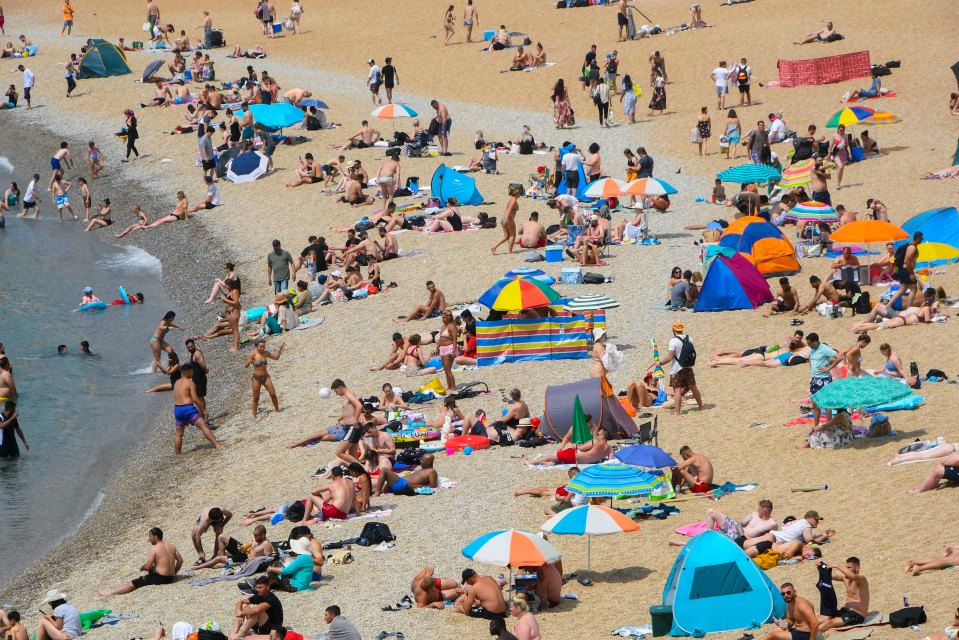 Hardy Brits took to the beach despite the surging heat