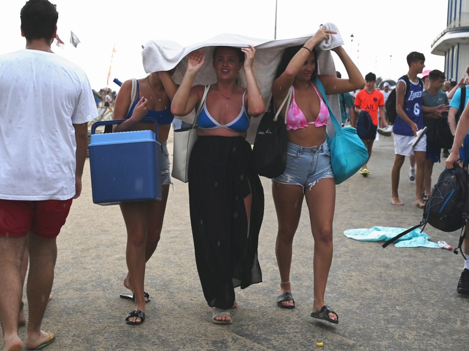 Beachgoers heading for cover as rain hit Bournemouth