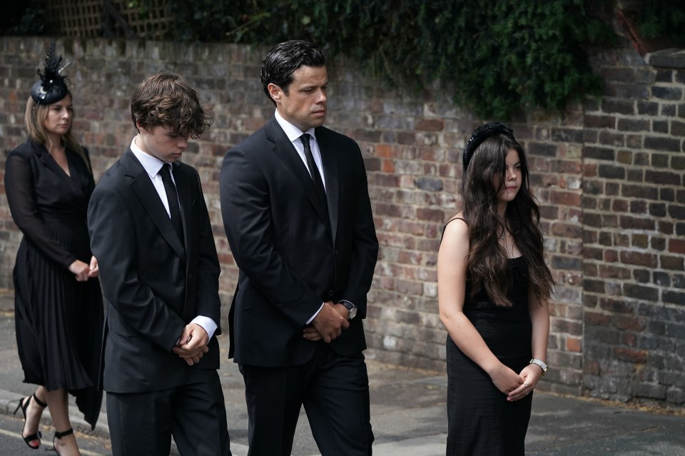 Son Hugo, husband Sebastien Bowen, and daughter Eloise (left to right) at Debs’ funeral