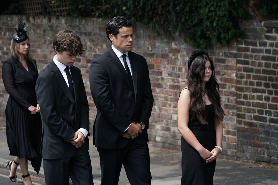 Son Hugo, husband Sebastien Bowen, and daughter Eloise (left to right) at Debs' funeral