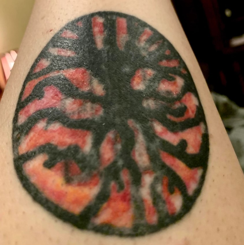 The woman shared the circular red and black tattoo on Reddit