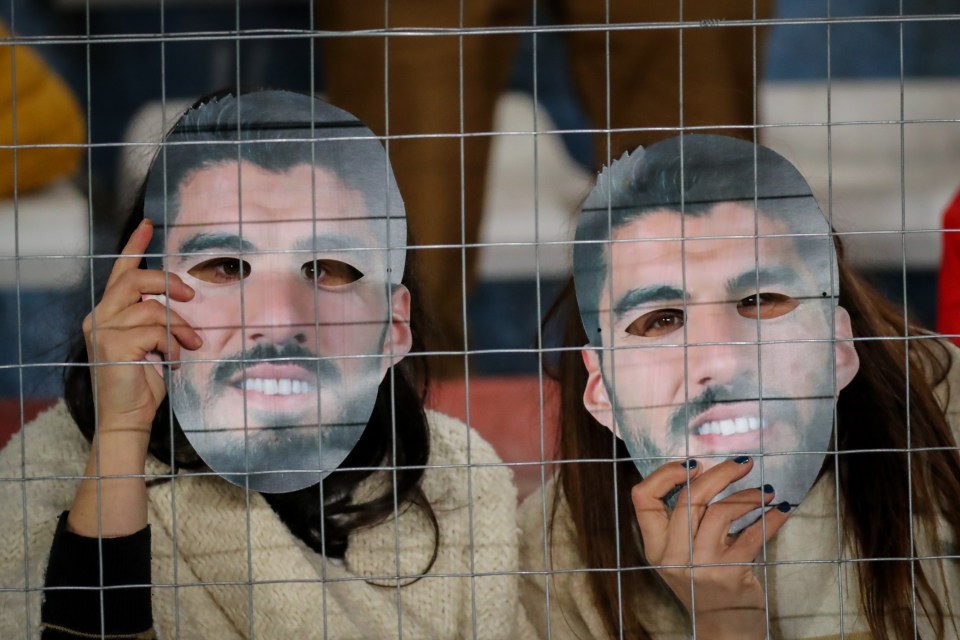 Nacional fans celebrated Luis Suarez’s imminent return with face masks of the star