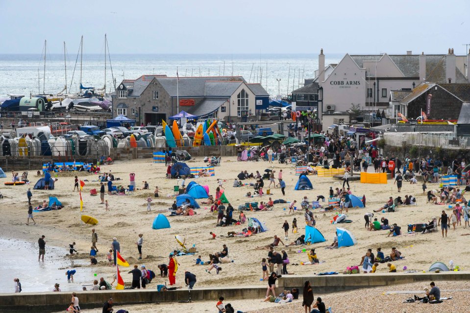 Beachgoers were also out in force in Lyme Regis, Dorset