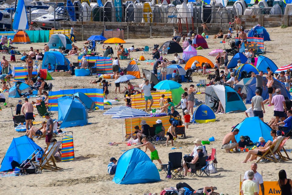 The beach at Lyme Regis, Dorset, was already getting busy this morning