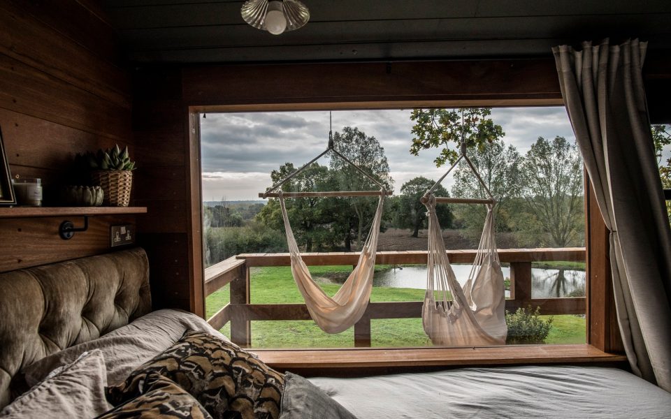 The bedroom opens out onto a deck with hammocks