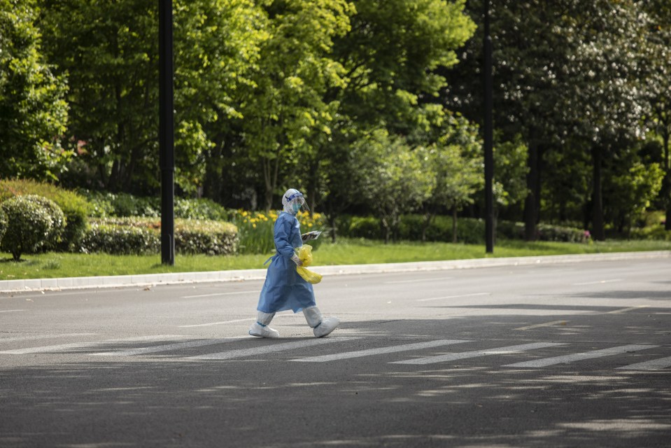 A worker in a hazmat suit in Shanghai earlier in the year