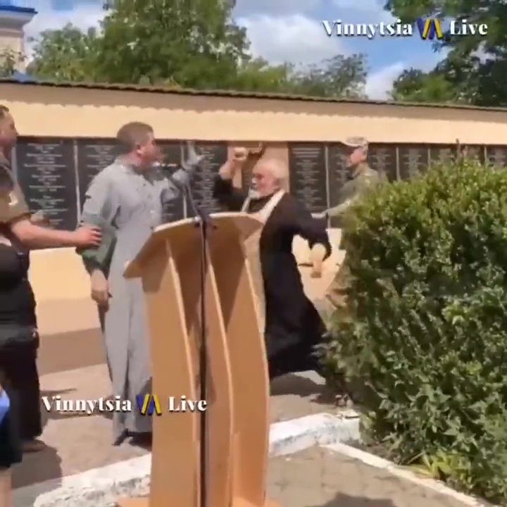 The moment Mykhailo Vasylyuk takes aim during a funeral