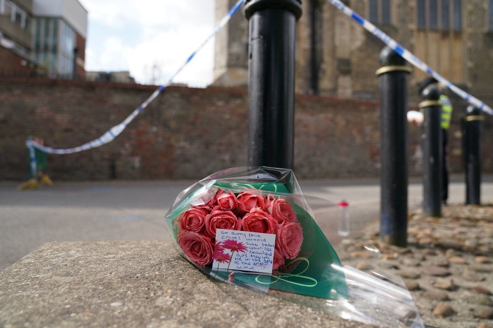 Heartbroken locals have left flowers and notes of condolence