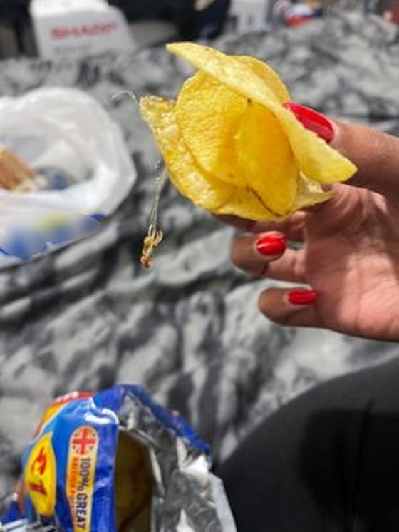 The mum said she noticed something 'stringy' hanging from one of the crisps