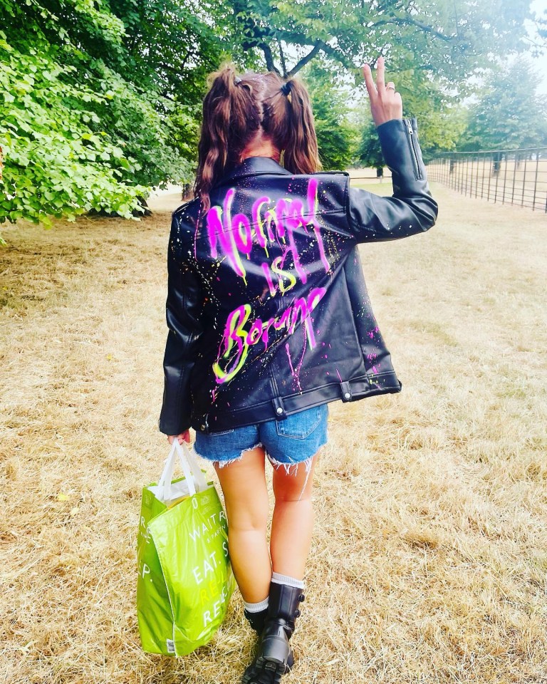 Becky donned a ‘normal is boring’ jacket on her way to a festival