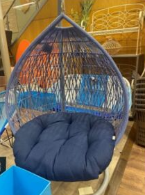 The egg chair is dark blue and may cause an injury if you sit on it