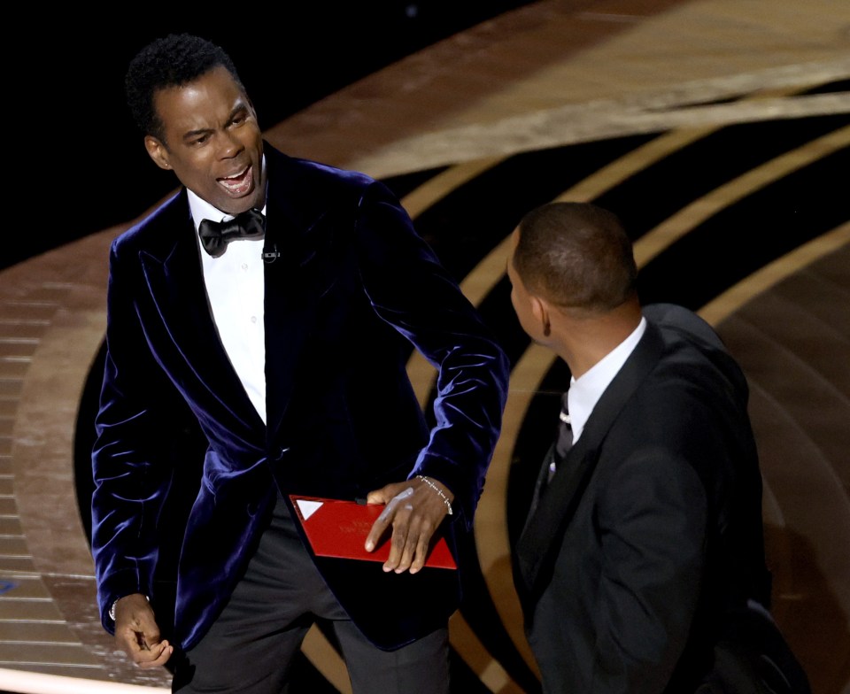 A shocked Chris Rock after being attacked by Will Smith on stage - which saw the actor banned from the Oscars