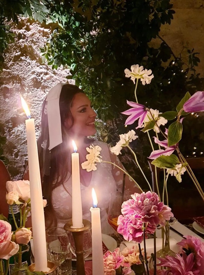 Kelly looked gorgeous in a plunging dress with lace sleeves as the couple enjoyed a candle lit wedding dinner