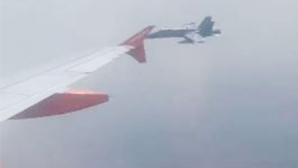 The F18 was spotted flying alongside the easyJet plane