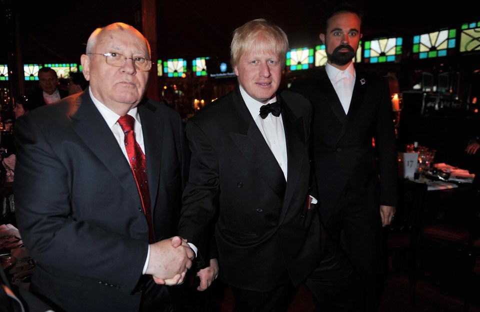 Boris Johnson, centre, said he was 'saddened' to hear of Mr Gorbachev's death